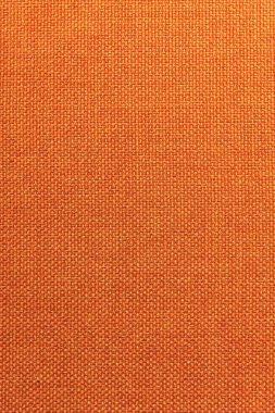 Dokulu arka plan yüzeyi Tekstil döşemelik mobilya yakın çekim. Turuncu renk kumaş yapısı