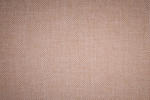 Texturerat bakgrund ytan av textil klädsel möbler närbild. beige färg tyg struktur — Stockfoto