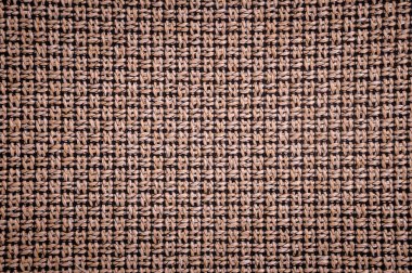 Dokulu arka plan yüzeyi Tekstil döşemelik mobilya yakın çekim. çuval bezi kahverengi renk kumaş yapısı