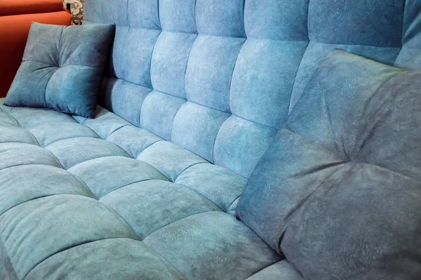 Close-up comfortable blue soft sofa with curly stitching. Modern design — Stock Photo, Image