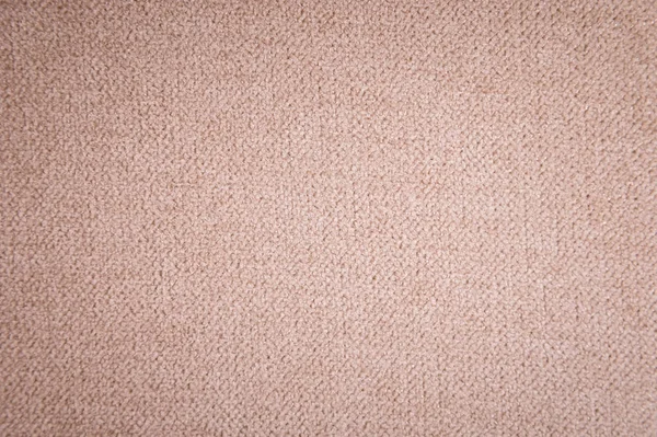 Texturierte Hintergrundoberfläche von textilen Polstermöbeln in Nahaufnahme. Gewebe beige Farbe Struktur — Stockfoto