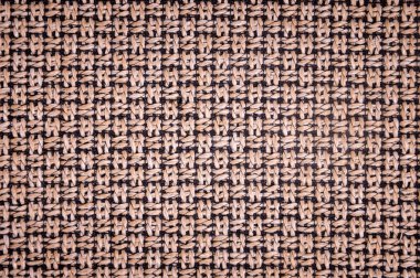 Dokulu arka plan yüzeyi Tekstil döşemelik mobilya yakın çekim. çuval bezi kahverengi renk kumaş yapısı