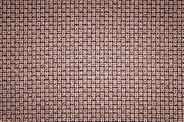 Dokulu arka plan yüzeyi Tekstil döşemelik mobilya yakın çekim. çuval bezi kahverengi renk kumaş yapısı
