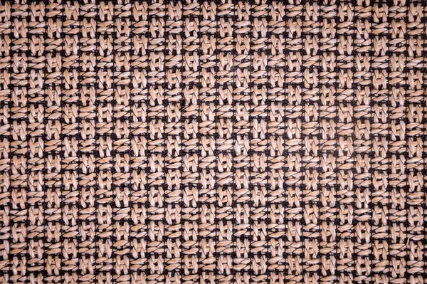 Dokulu arka plan yüzeyi Tekstil döşemelik mobilya yakın çekim. çuval bezi kahverengi renk kumaş yapısı