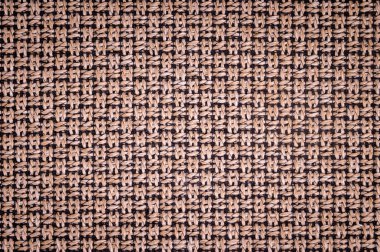 Dokulu arka plan yüzeyi Tekstil döşemelik mobilya yakın çekim. çuval bezi kahverengi renk kumaş yapısı