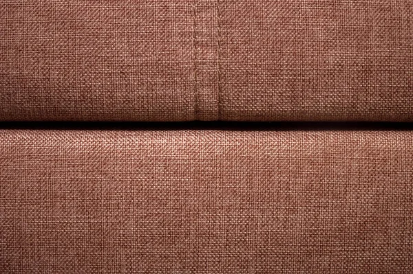 Um close-up de um fragmento de um sofá têxtil bege caro no quarto — Fotografia de Stock