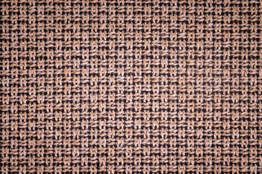 Dokulu arka plan yüzeyi Tekstil döşemelik mobilya yakın çekim. çuval bezi kahverengi renk kumaş yapısı