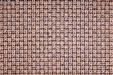 Dokulu arka plan yüzeyi Tekstil döşemelik mobilya yakın çekim. çuval bezi kahverengi renk kumaş yapısı