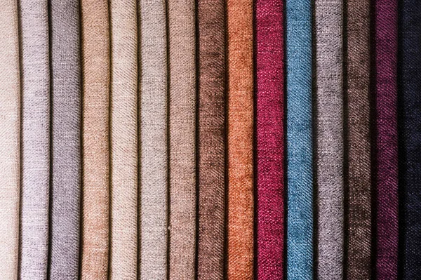 Colorful and bright fabric samples of furniture and clothing upholstery. Close-up of a palette of textile abstract stripes of different colors — Stock Photo, Image