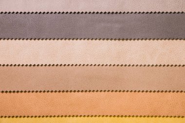 Renkli ve parlak kumaş deri mobilya ve giyim Döşeme örnekleri. Bir palet Tekstil soyut çizgiler farklı renkteki Close-up