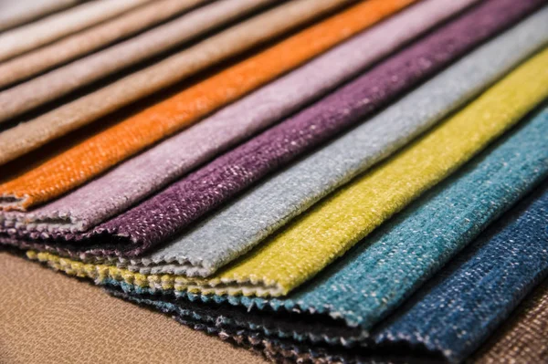 Colorful and bright fabric samples of furniture and clothing upholstery. Close-up of a palette of textile abstract stripes of different colors — Stock Photo, Image