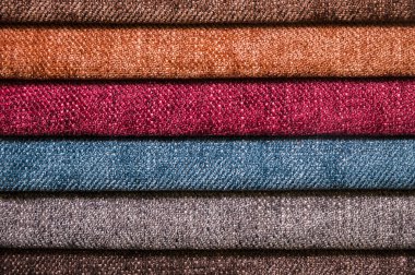 Mobilya ve giyim Döşeme renkli ve parlak kumaş örnekleri. Bir palet Tekstil soyut çizgiler farklı renkteki Close-up