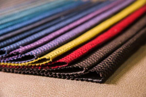 Colorful and bright fabric samples of furniture and clothing upholstery. Close-up of a palette of textile abstract stripes of different colors — Stock Photo, Image