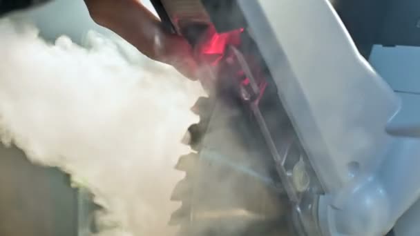 Close-up machine circular saw in wood in smoke. round blade detail. Malfunction or overheating of the tool — Stock Video