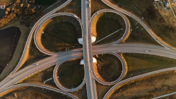 Aerial view. Highway and overpass with cars and trucks. The road junction is a two-tier road junction outside the city. view over — Stock Video