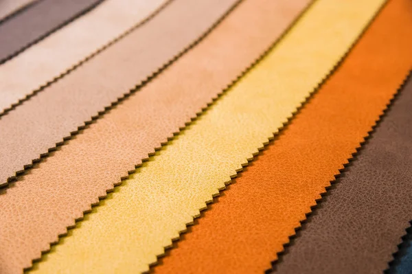 Colorful and bright fabric samples of leatherette furniture and clothing upholstery. Close-up of a palette of textile abstract stripes of different colors — Stock Photo, Image