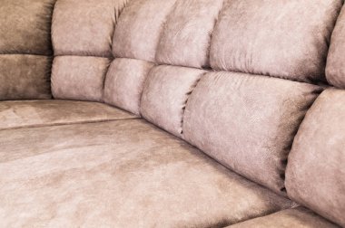 Kahverengi tonları ile bej renk pahalı bir yumuşak tekstil kanepe yakın çekim. İç Arka Plan