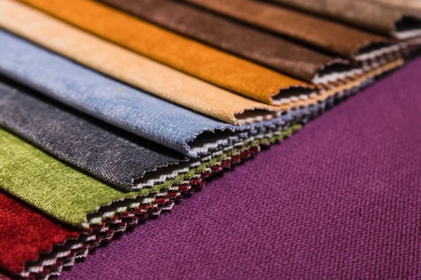 Colorful and bright fabric samples of furniture and clothing upholstery. Close-up of a palette of textile abstract stripes of different colors — Stock Photo, Image