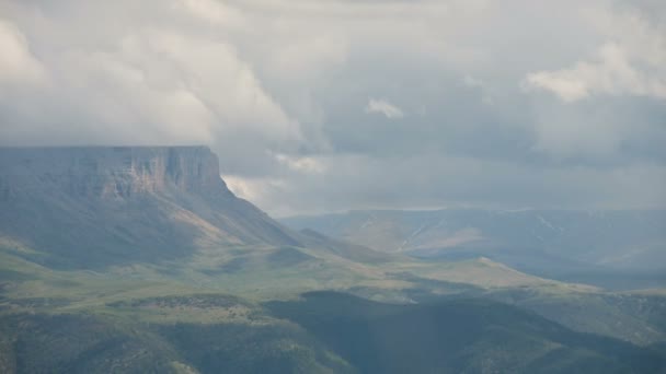 4k timelapse of the green valley in the North Caucasus at the foot of the epic plateau. Weather change and telephoto forecast — Stock Video