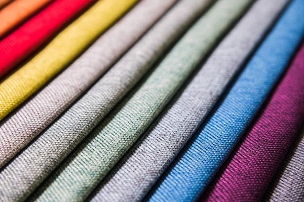 Colorful and bright fabric samples of furniture and clothing upholstery. Close-up of a palette of textile abstract stripes of different colors — Stock Photo, Image