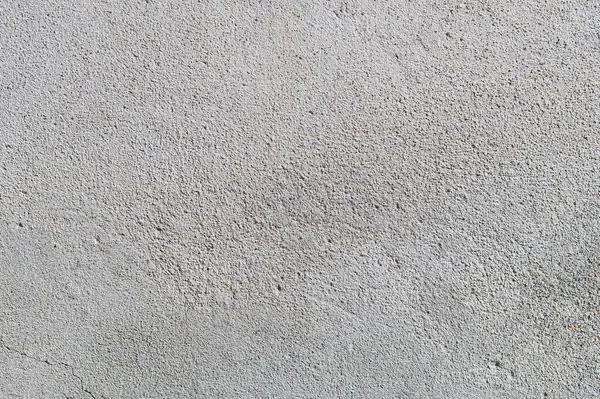 Grijs getextureerde cementwand achtergrond met fijne betonnen chips. Achtergronden van de bouw — Stockfoto