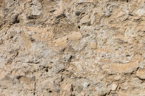 Ancient stone building mix of the exposed facade of the building during restoration. Grunge Abstract Background