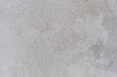 Gri desenli çimento duvar arkaplanı ve ince beton parçaları. İnşaat geçmişleri