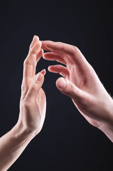 A close-up of two hands male and female gently touch each other. The concept of tremulous rejection between the sexes — Stock Photo, Image