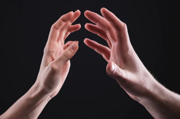 A close-up of two hands male and female gently touch each other. The concept tremulous rejection between the sexes — Stock Photo, Image