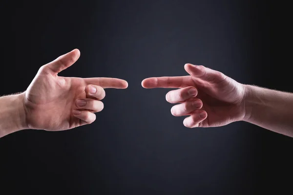 Two mens hands point at each other with index fingers. The concept of mutual understanding between men expressed in hand gestures — Stock Photo, Image