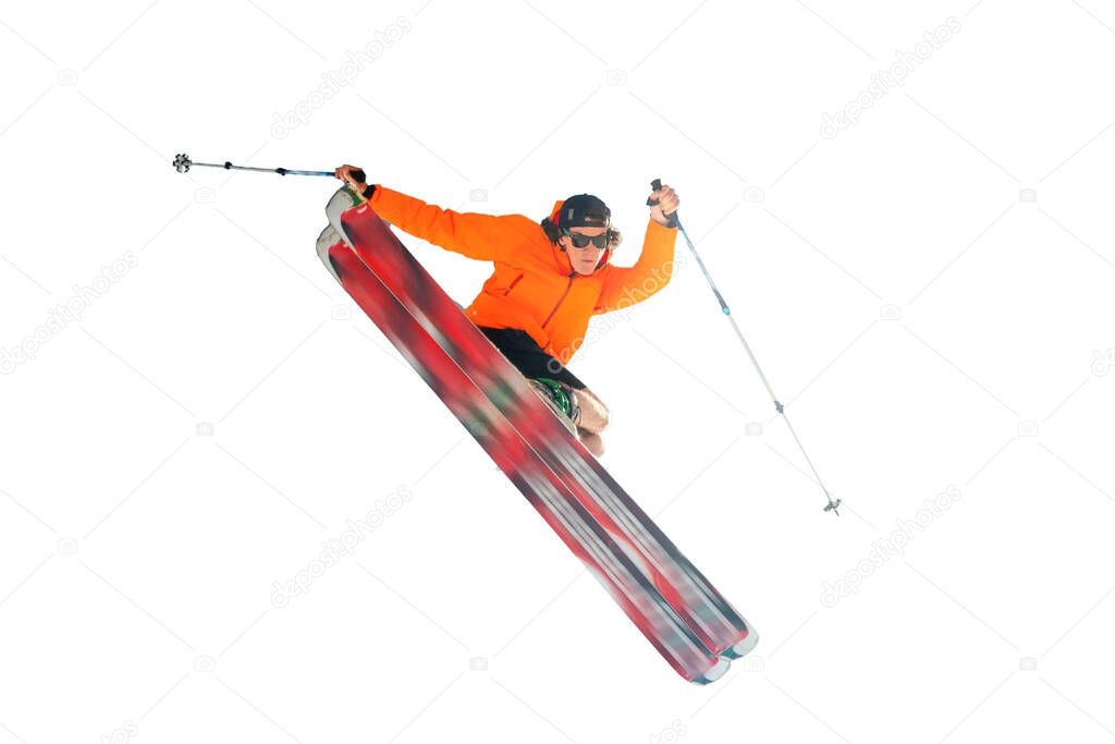 Stylish skier in orange jacket cap and sunglasses in jump does the trick isolated on a white background