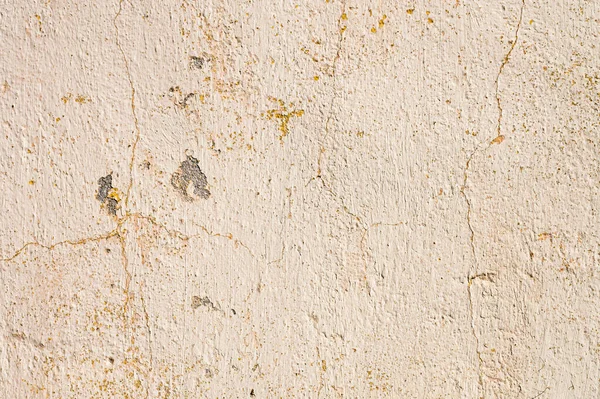 Fondo grunge de la pared de masilla pelada nube agrietada en tonos beige — Foto de Stock