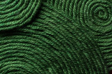 Yeşil iplik dokusu yakın çekim, makro. Dikiş başlığı, soyut arkaplan.