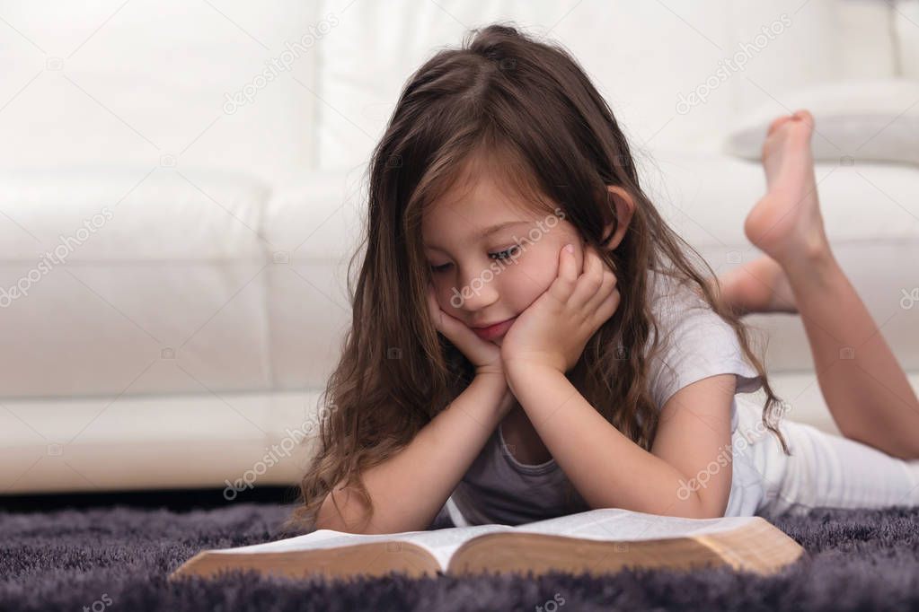 Young Child Learning the Word of God