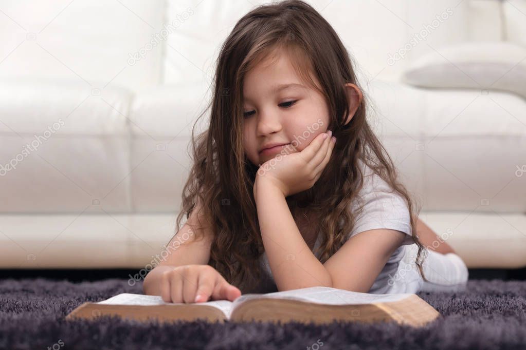 Young Child Learning the Word of God