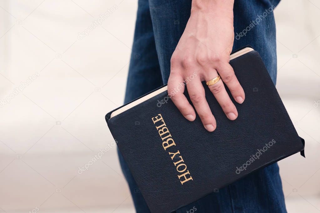 Adult Male Holding the Word of God 