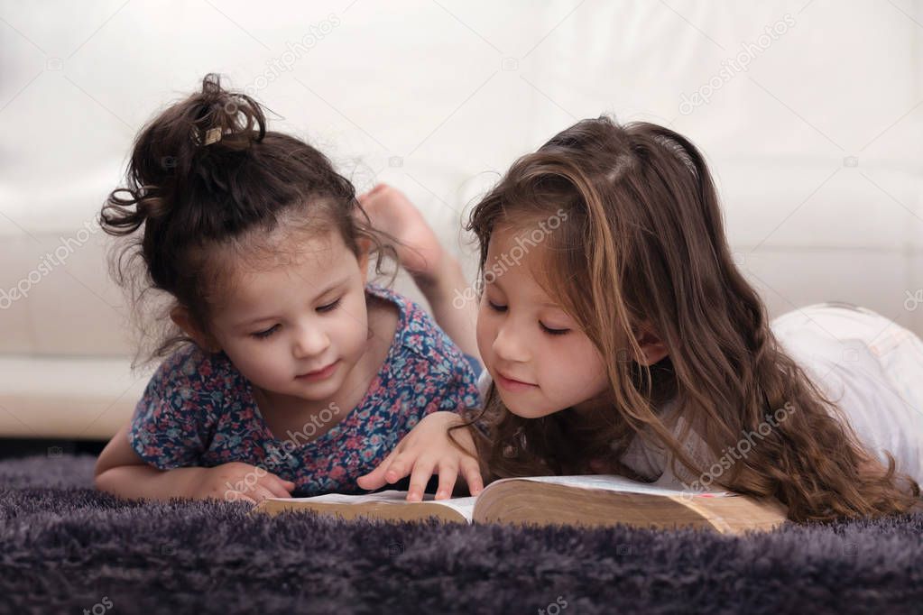 Young Siblings Learning the Word of God Together