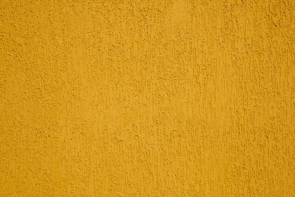 背景として黄色の漆喰壁の質感 — ストック写真