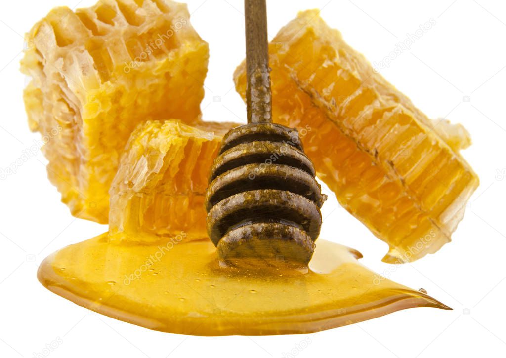 Honeycomb with honey spoon isolated on white background, bee natural ingredients concept