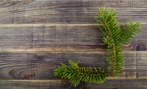 Christmas Tree Branch Wooden Background — Stock Photo, Image