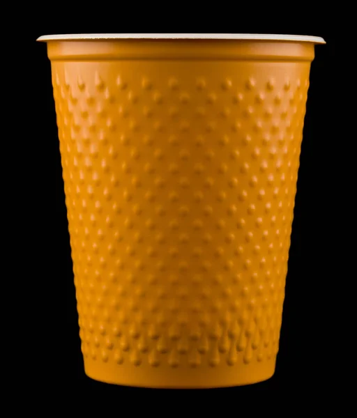 plastic cup isolated on black background close up