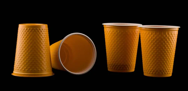 plastic cup isolated on black background close up