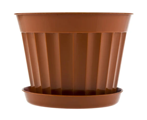 白い背景に隔離された茶色のプラスチック製の植木鉢クローズアップ. — ストック写真