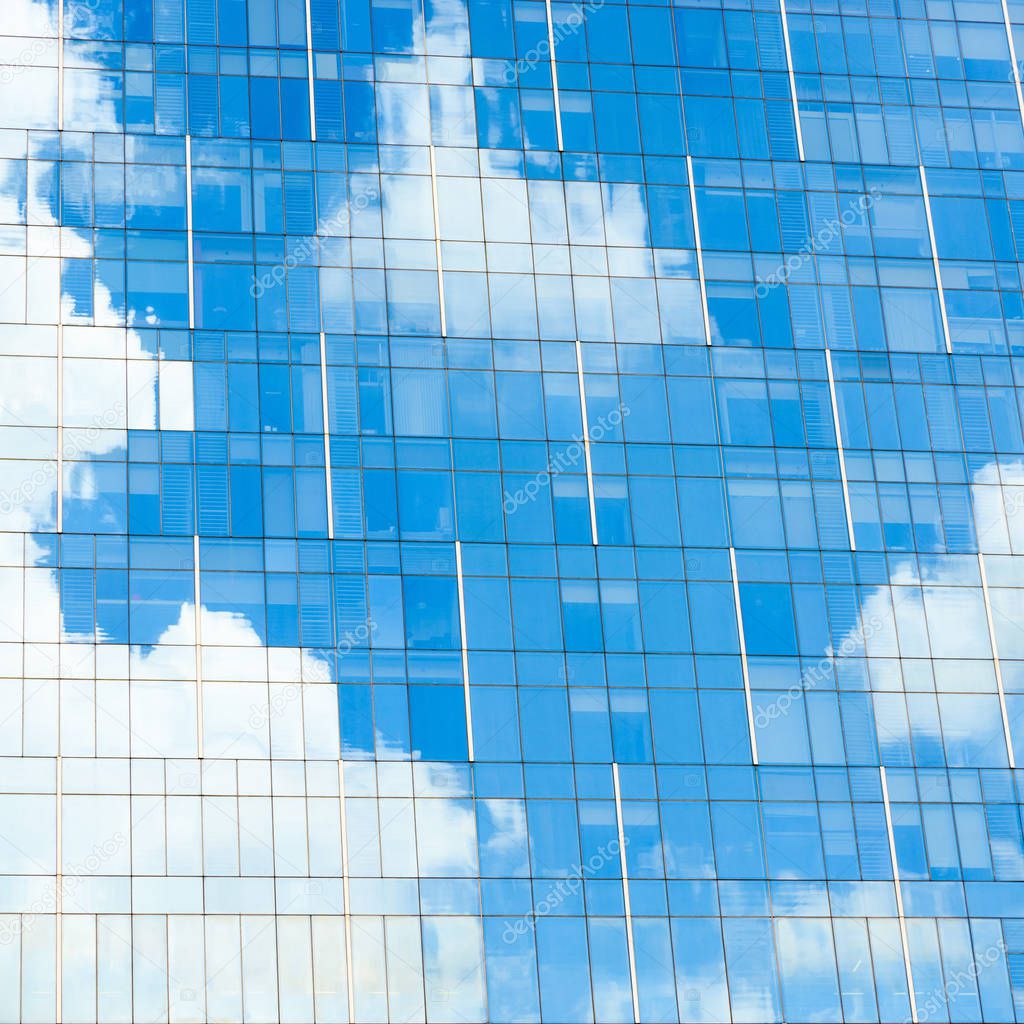 Blue sky reflection on office building
