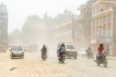 Traffic and dust at Boudha Road in Kathmandu, Nepal clipart