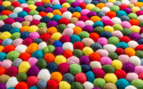 Multicolored felt ball rug detail — Stock Photo, Image