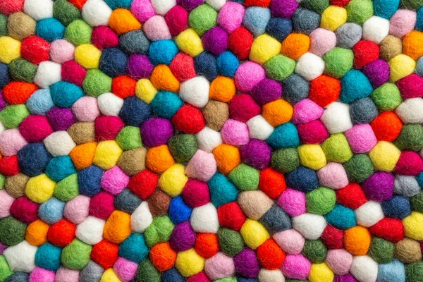 Multicolored felt ball rug detail — Stock Photo, Image