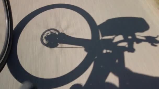 Bicycle front wheel shadow — Stock Video