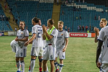 Odessa, Ukrayna - 3 Ağustos 2018: Futbolcular, Fc Djurgardens Eğer İsveç Melkemichel özcan sırasında oyun Uefa Avrupa Ligi 2018 Fc Mariupol (Ukrayna) ile futbol sahada. Futbol oyuncular Tren