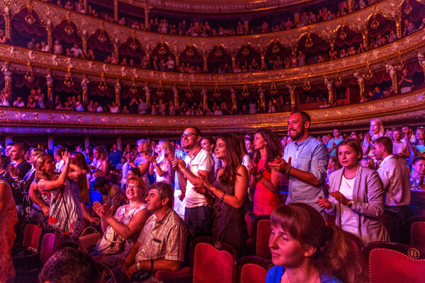 ODESSA, UKRAINE - July 16, 2016: Ukrainian singer Jamala at solo concert at  Opera House. Satisfied with  fans in hall. Spectators at  concert during  creative light and music show fashionable jazz orchestra